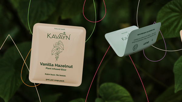 Kavain product tags hanging against a green leafy background